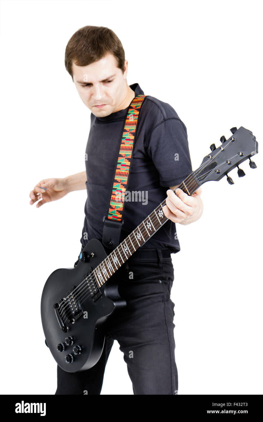 junger Mann mit einer e-Gitarre. Isoliert Stockfoto
