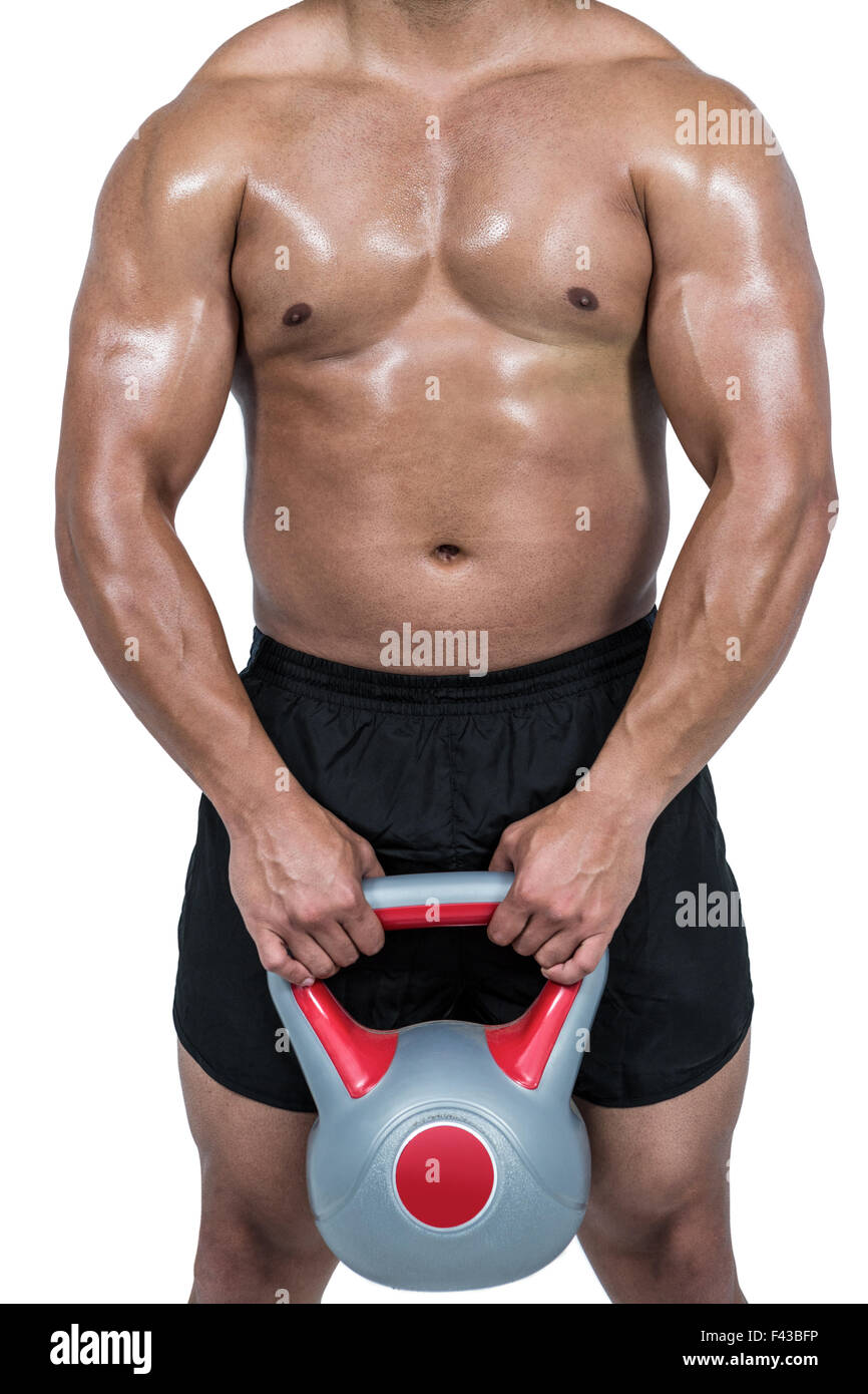 Muskulöser Mann heben schwere kettlebell Stockfoto