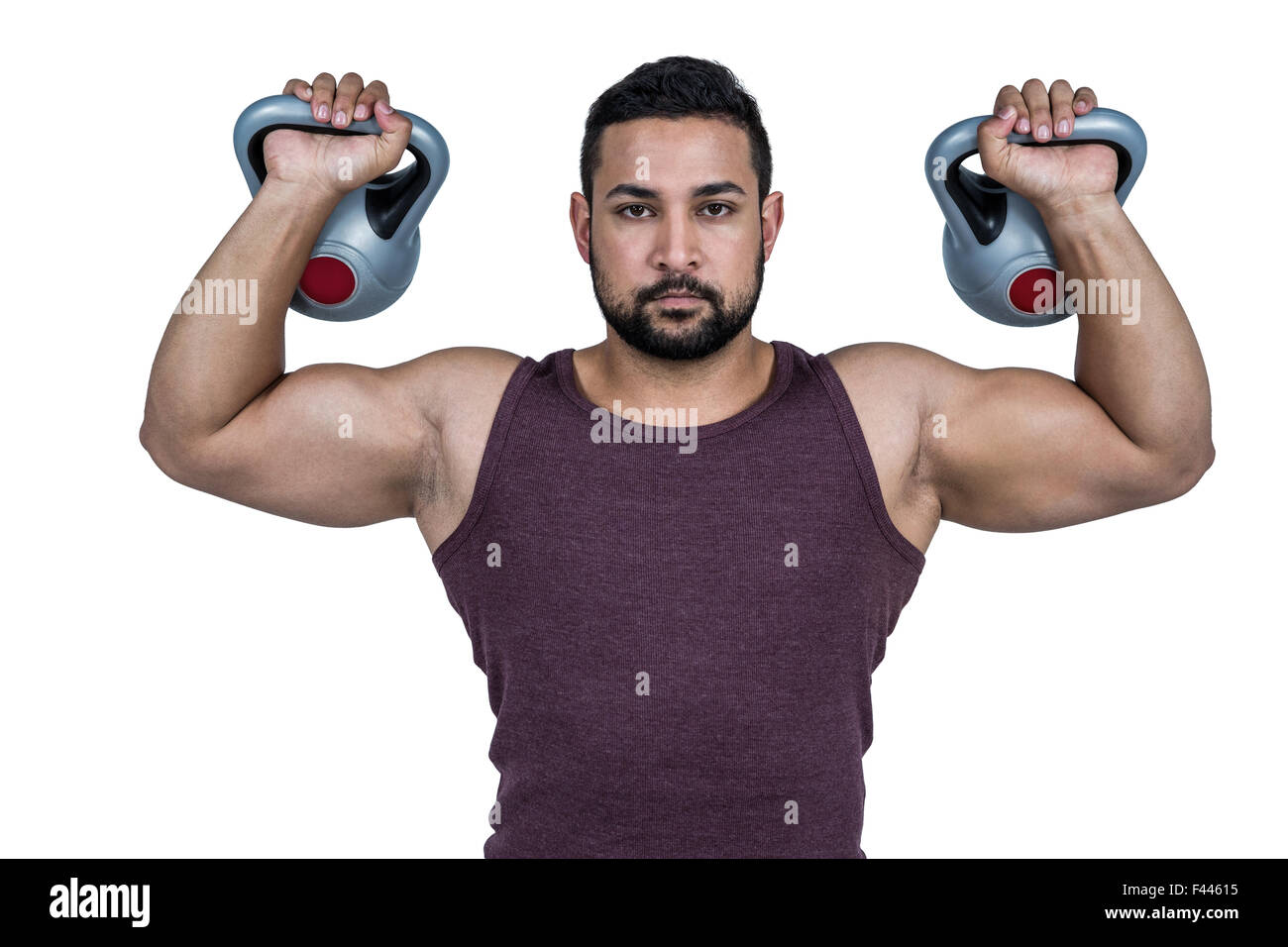 Muskuläre ernster Mann heben kettlebells Stockfoto