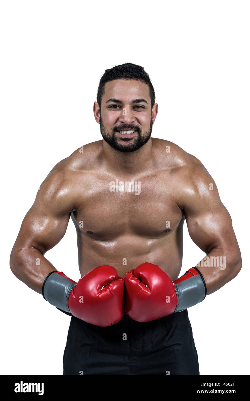 Muskulöser Mann Boxen in Handschuhe Stockfoto