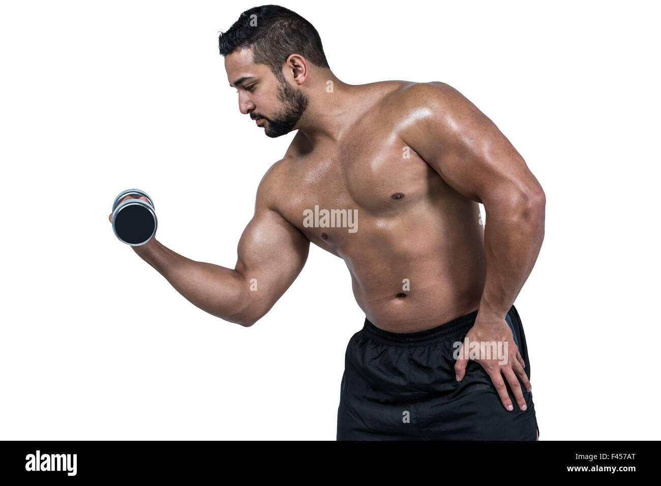 Muskulöser Mann heben schwere Hantel Stockfoto