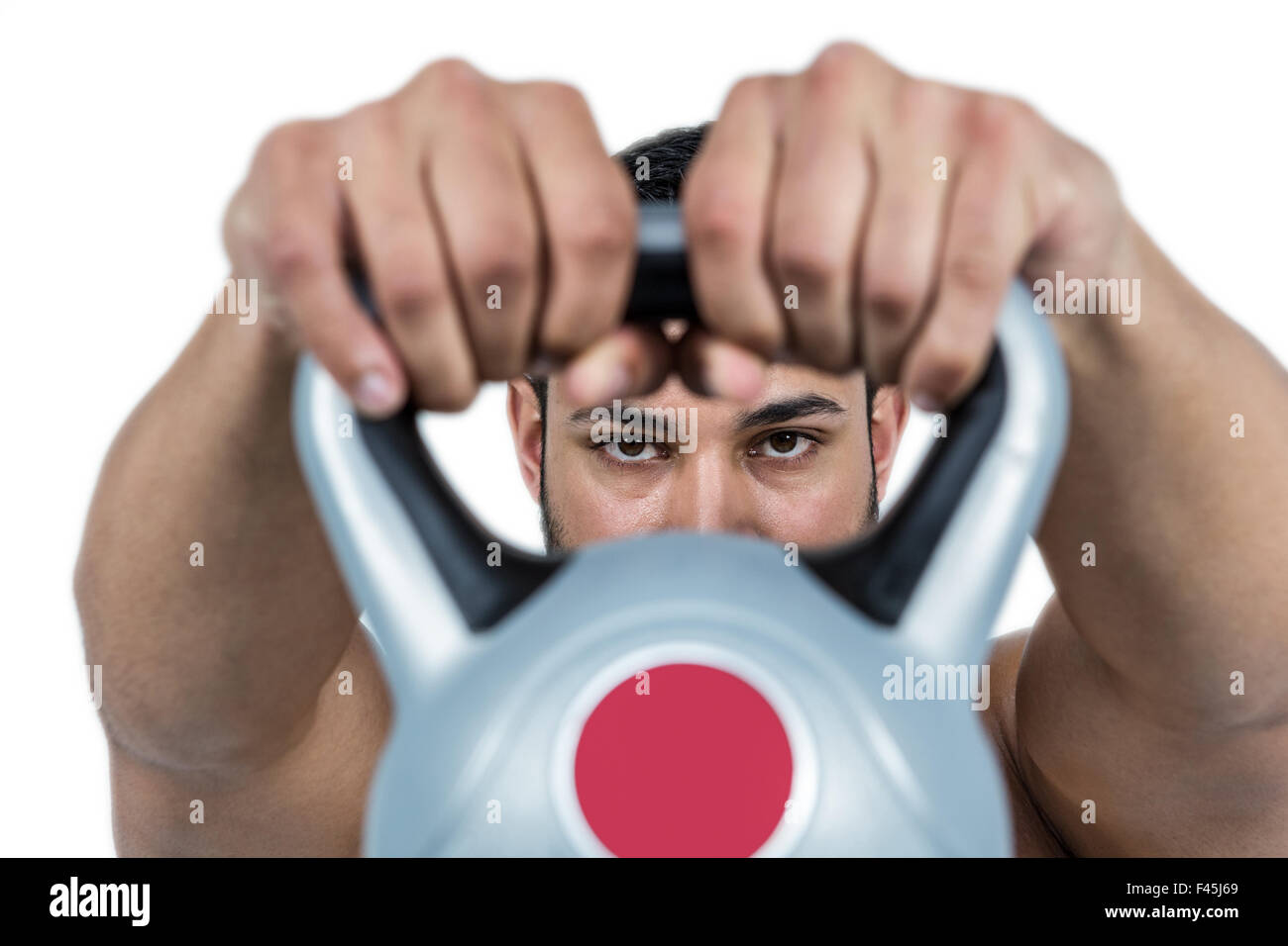 Muskulöser Mann heben schwere kettlebell Stockfoto