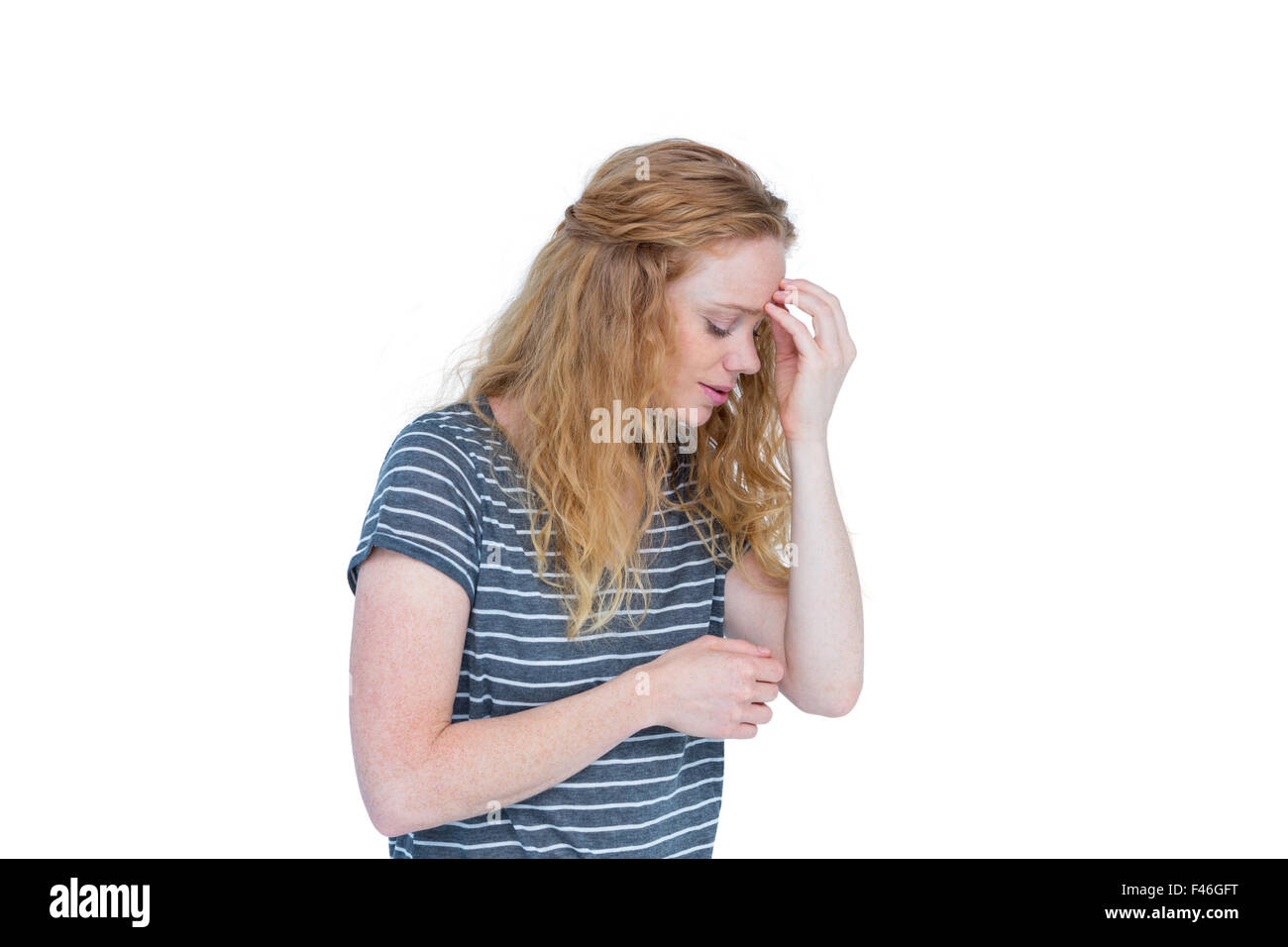 Frau mit Kopfschmerzen, die Nase kneifen Stockfoto