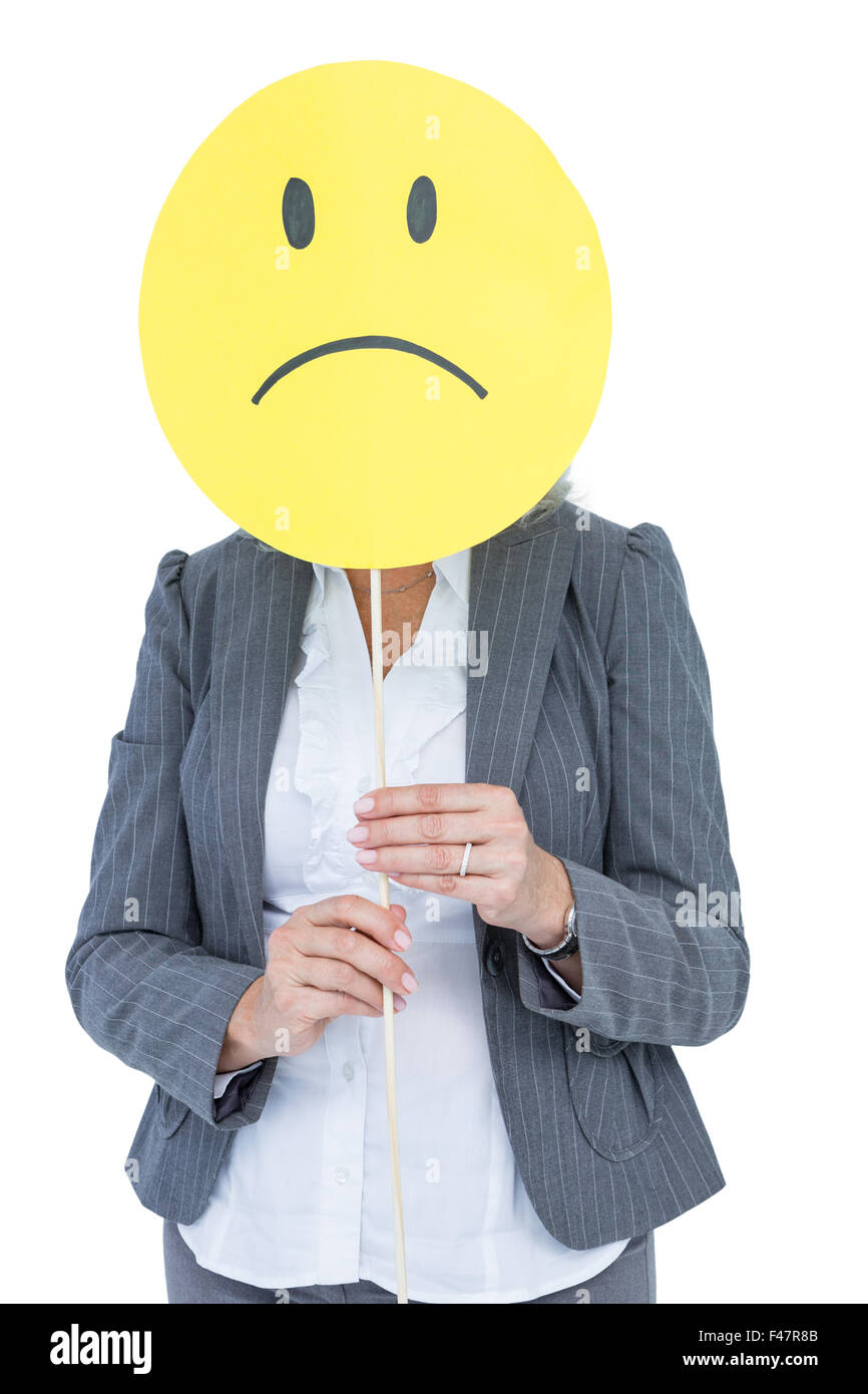 Geschäftsfrau Holding traurige Smiley-Gesicht Stockfoto