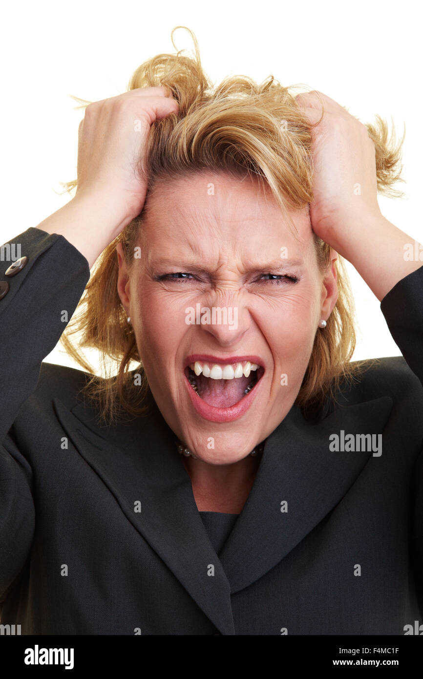 Frustriert Geschäftsfrau ziehen ihr Haar und schreien Stockfoto