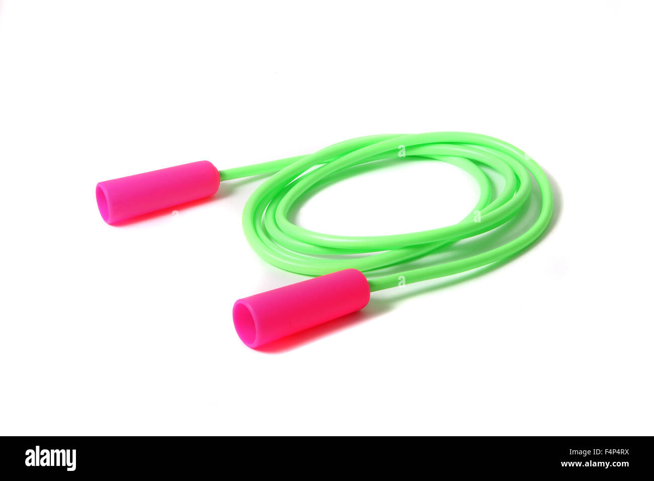 Bunte Mädchen überspringen Seil Spielzeug in rosa und grün auf weißem Hintergrund Stockfoto
