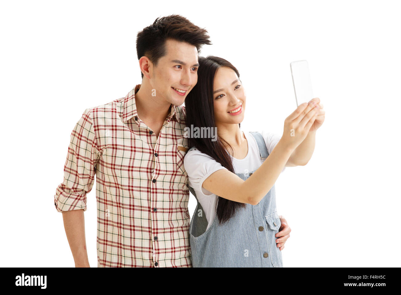 Junge Paare mit einer Handy-Kamera Stockfoto
