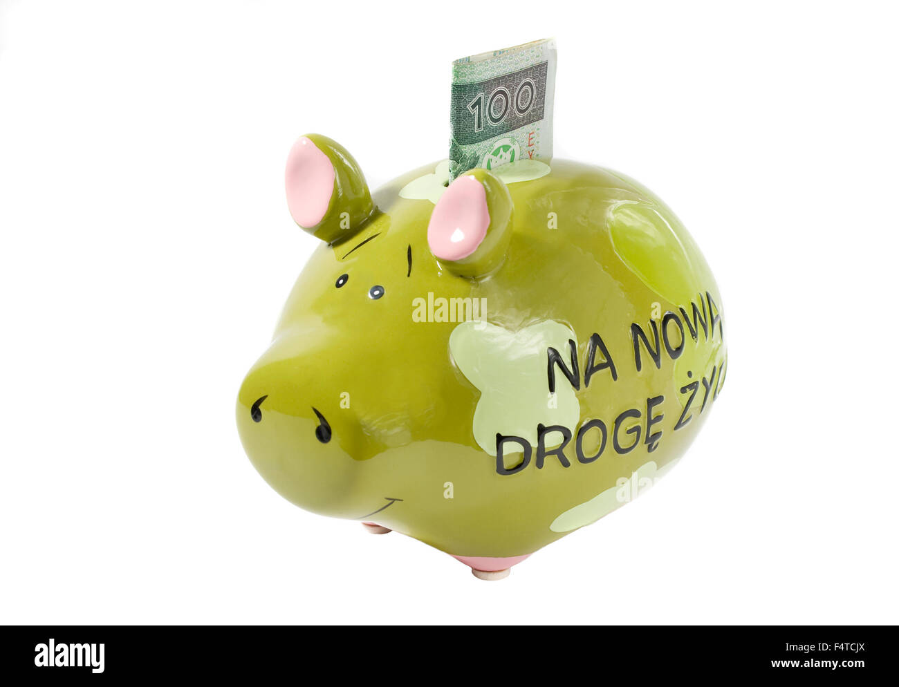 Grüne Sparschwein mit hundert polnische Zloty Rechnung. Stockfoto