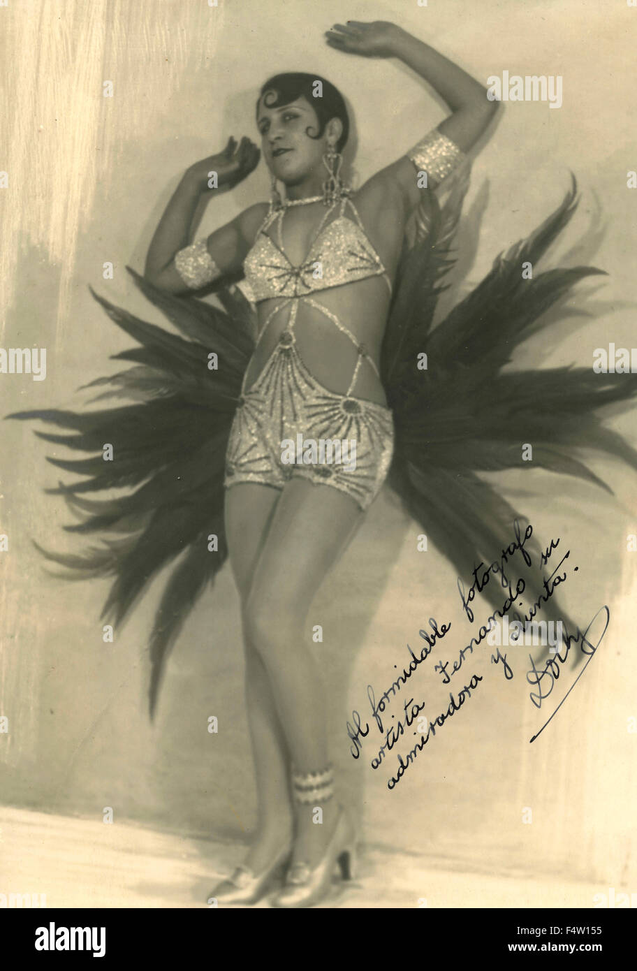 Eine burleske Tänzerin Outfit mit einem gefiederten Stockfoto