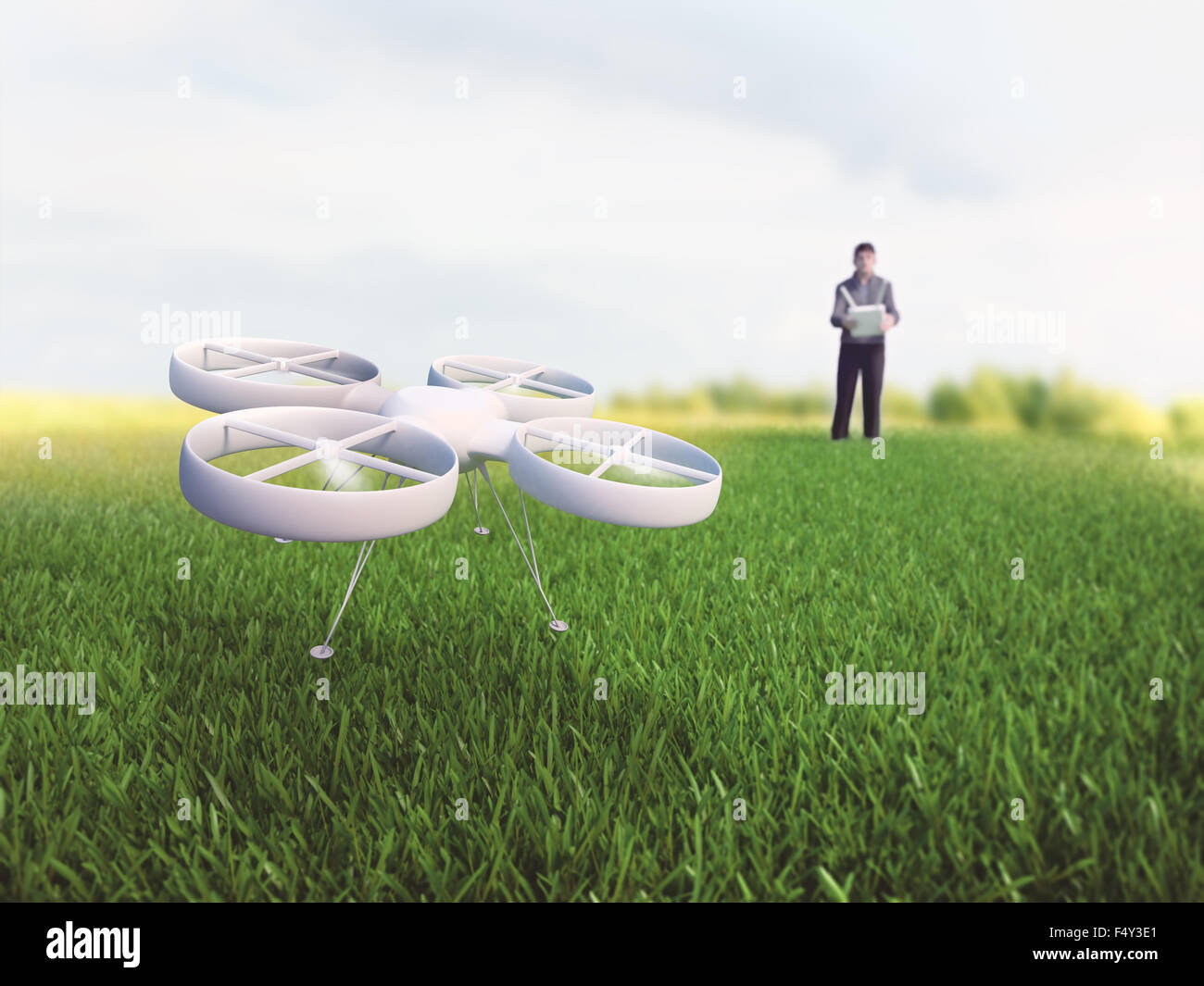 Drohnen-Pilot einen Quadcopter in Betrieb Stockfoto