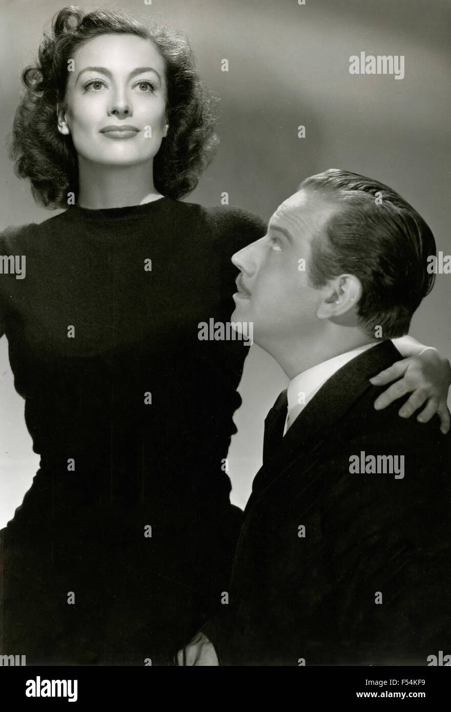 Die Schauspieler Joan Crawford und Melvyn Douglas in einer Szene aus dem Film "das Gesicht einer Frau" Stockfoto