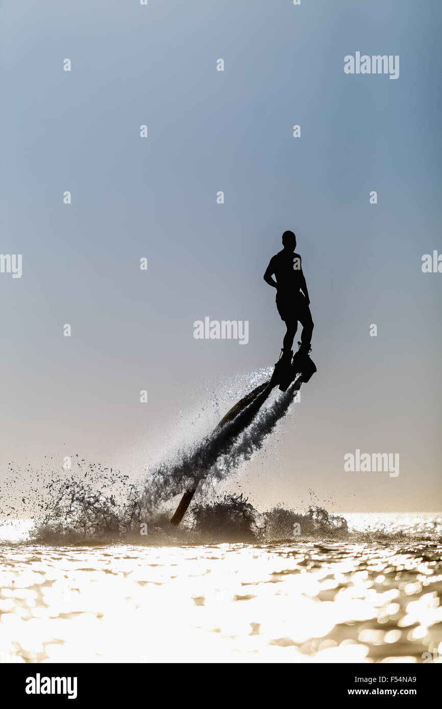 Silhouette eines Reiters fliegen board Stockfoto