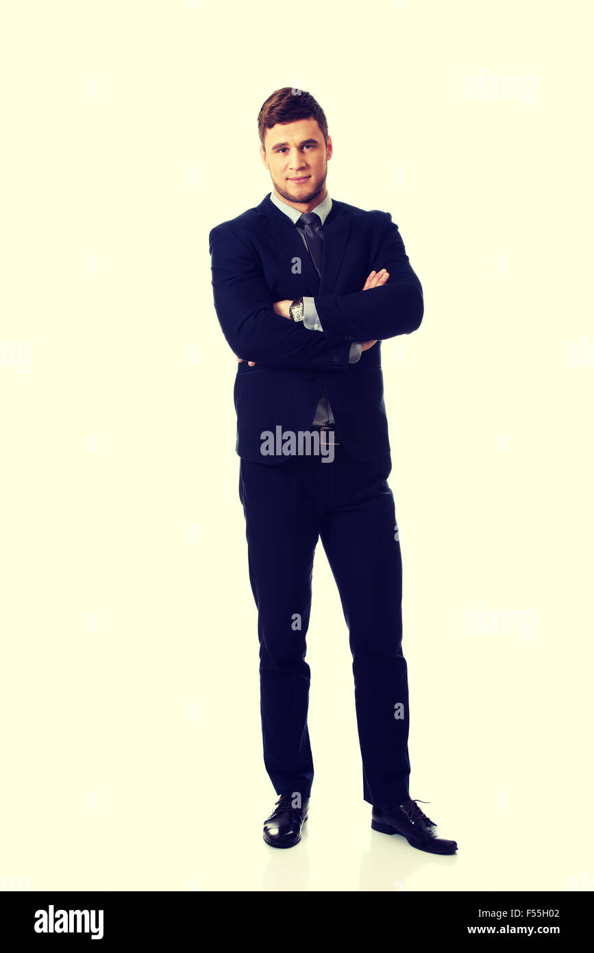 Erfolgreicher Geschäftsmann mit verschränkten Armen. Stockfoto