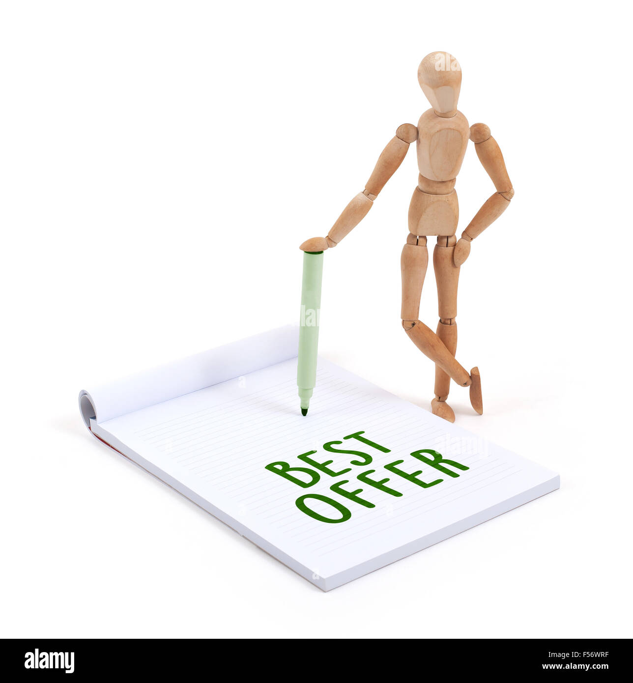 Hölzerne Puppe schreiben in einem Scrapbook - Bestes Angebot Stockfoto