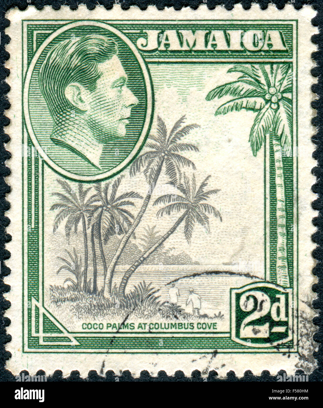Briefmarke gedruckt in Jamaika, zeigt ein Porträt von König George VI und Kokospalmen Columbus Cove, ca. 1938 Stockfoto
