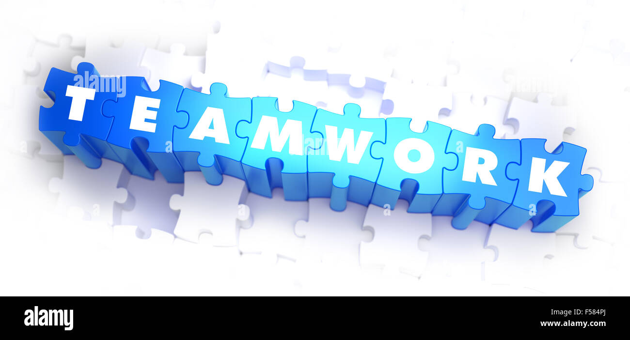 Teamarbeit - Rätsel weiß Wort auf blau auf weißem Hintergrund. 3D Illustration. Stockfoto