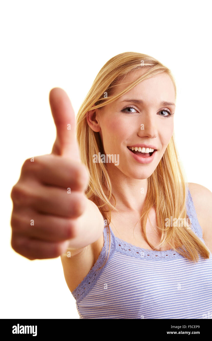 Junge blonde Frau, die den Daumen hochhalten Stockfoto