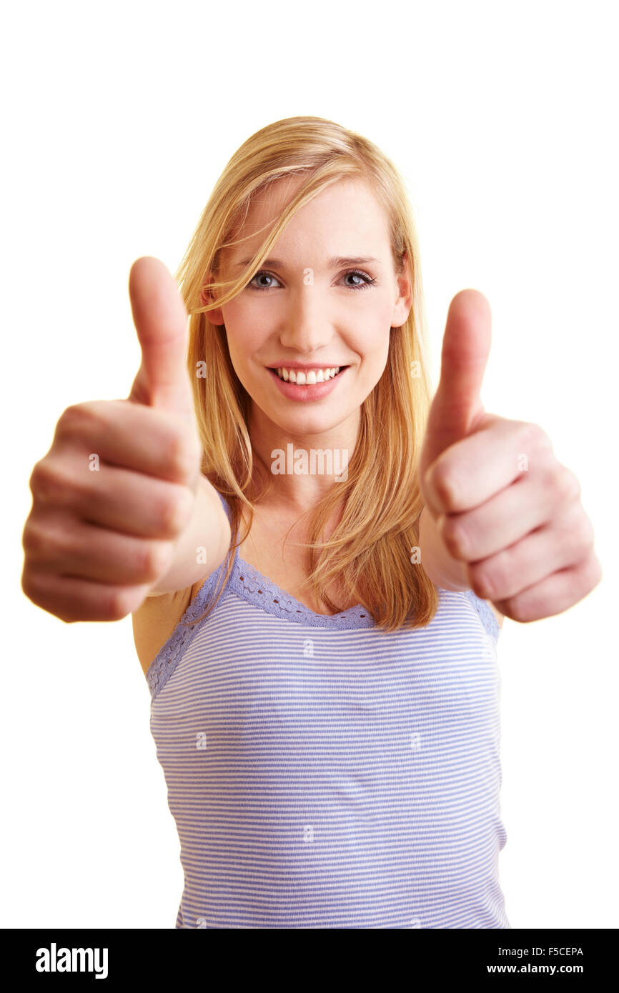 Junge blonde Frau, die zwei Daumen hochhalten Stockfoto