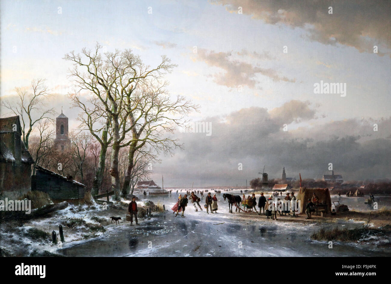 Zahlreiche Skater und ein Pferdeschlitten an einem Imbissstand in der Nähe einer niederländischen Stadt 1857 Gemälde von Andreas Schelfhout 1787-1870 Niederländischer Maler, Radierer Stockfoto