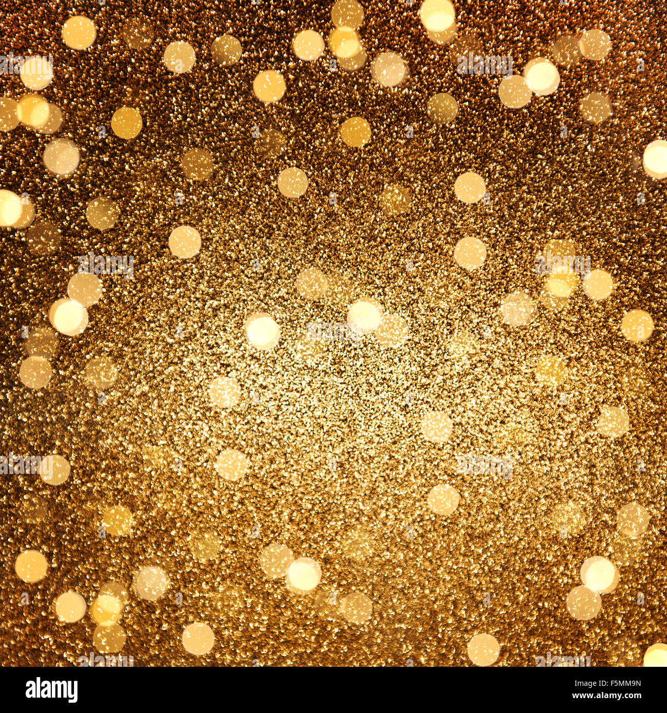 Golden glänzende Lichter. Abstrakte festliche Feiertage Hintergrund Stockfoto