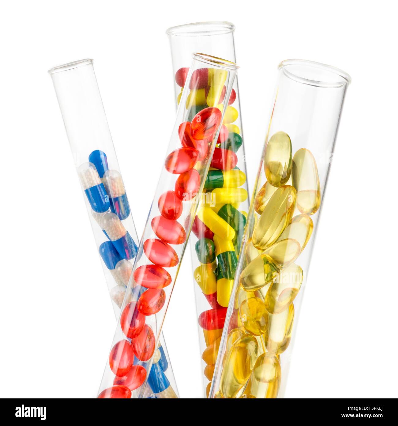 Pillen und Kapseln in den Reagenzgläsern vor einem weißen Hintergrund. Stockfoto