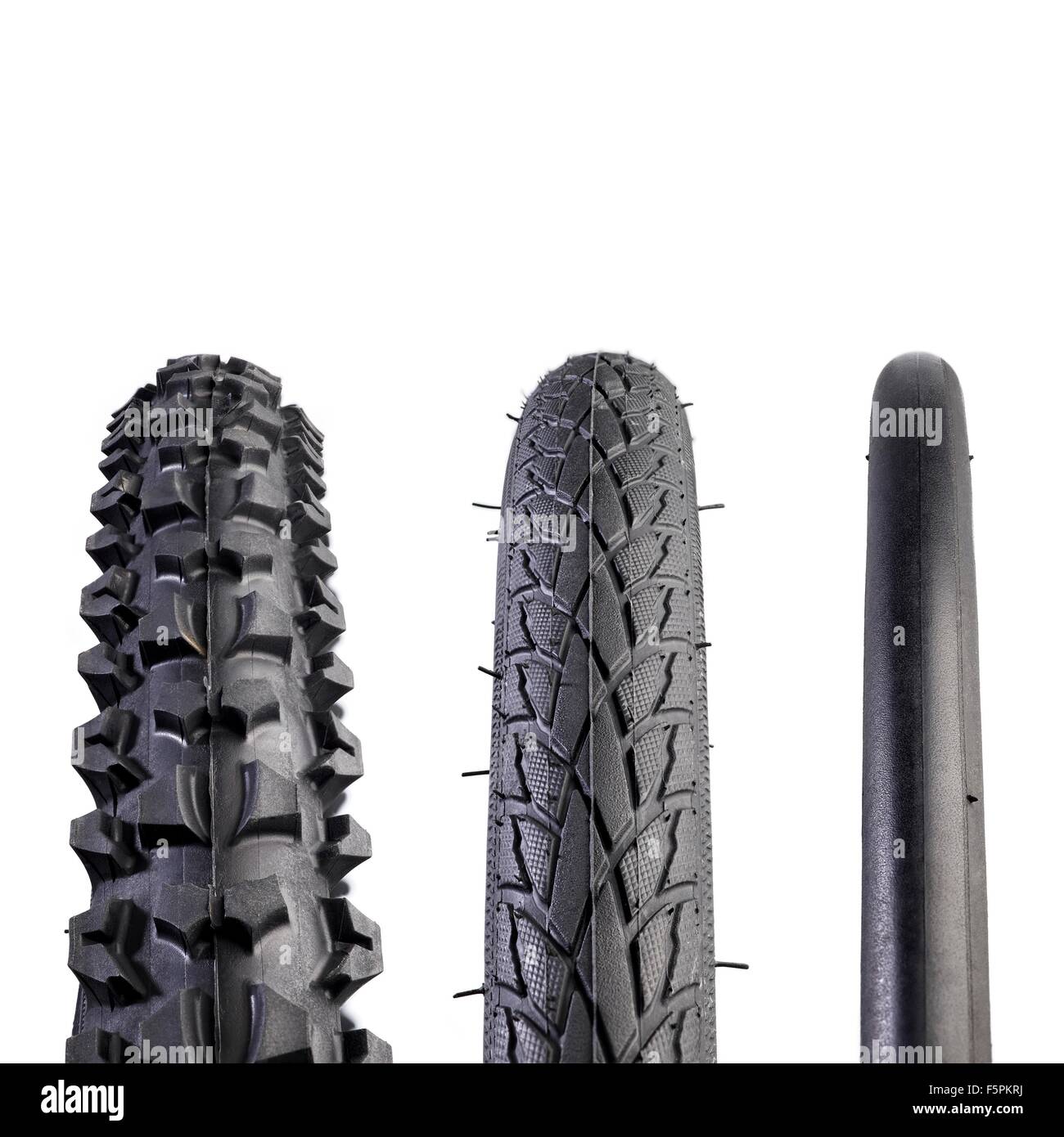 Fahrrad-Reifen, Nahaufnahme. Von links nach rechts sind a: Mountain Bike Reifen, Hybrid Reifen und Straße Fahrrad Reifen. Stockfoto