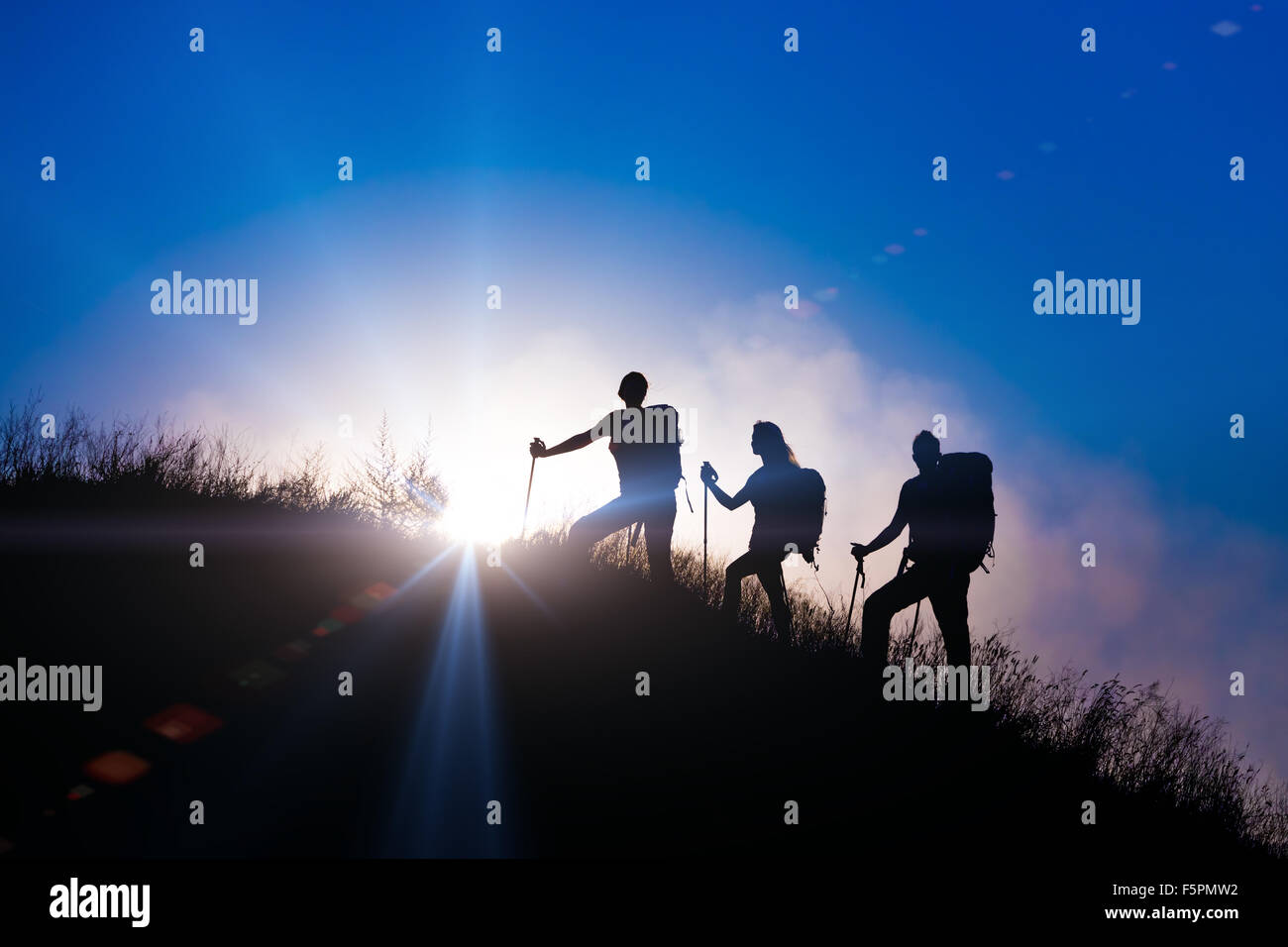 Drei Personen Familie Silhouetten im Urlaub Stockfoto