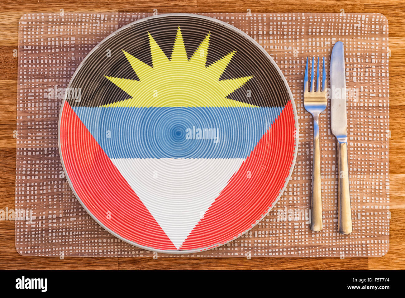 Teller mit der Flagge von Antigua und Barbuda drauf für Ihre internationale Speisen und Getränke-Konzepte. Stockfoto