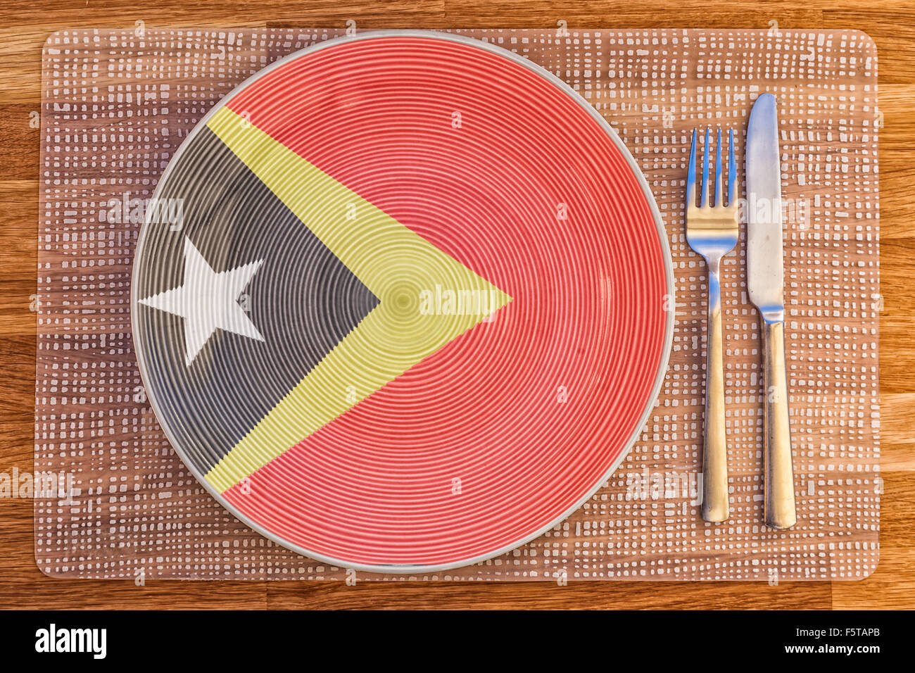 Teller mit der Flagge von Timor-Leste drauf für Ihre internationale Speisen und Getränke-Konzepte. Stockfoto