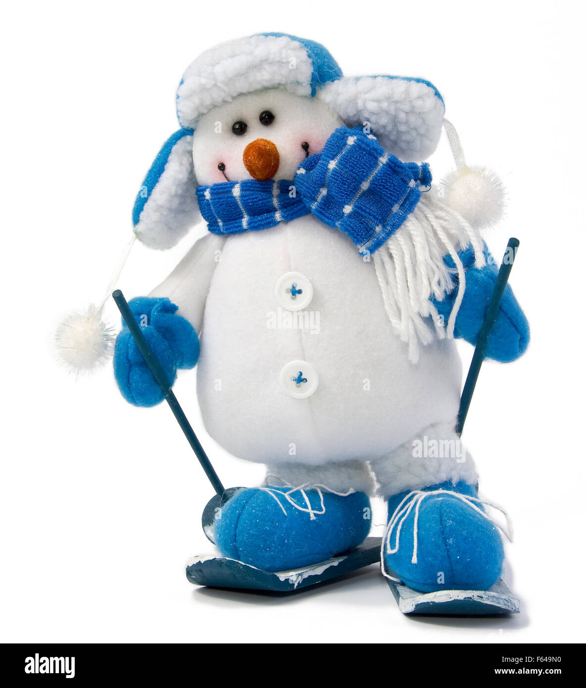 Schneemann im Ski mit Mütze und Schal isoliert auf weißem closeup Stockfoto