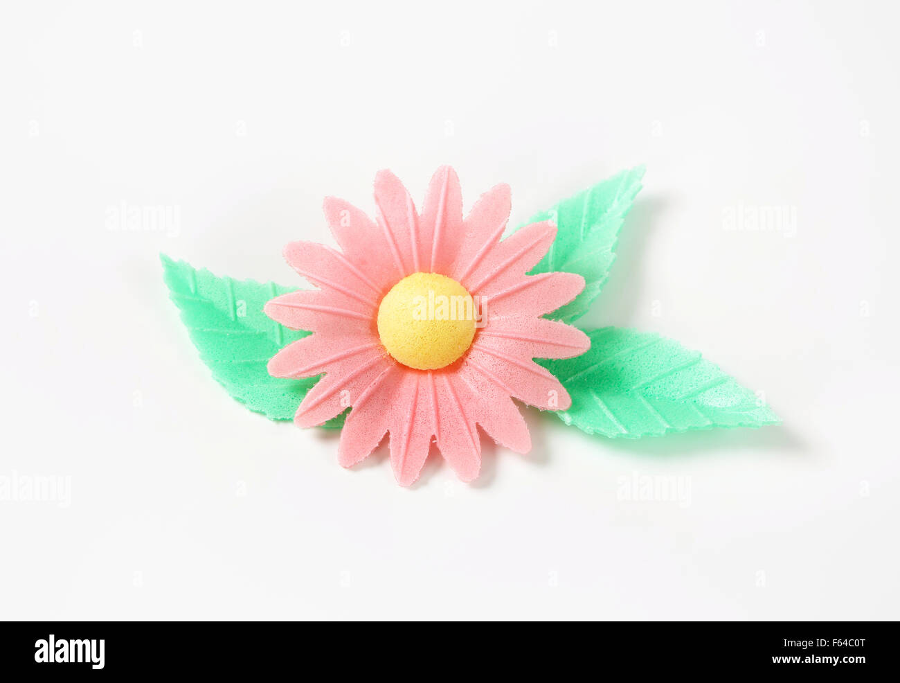 Zucker-Blume - essbare Kuchendekoration auf weißem Hintergrund Stockfoto
