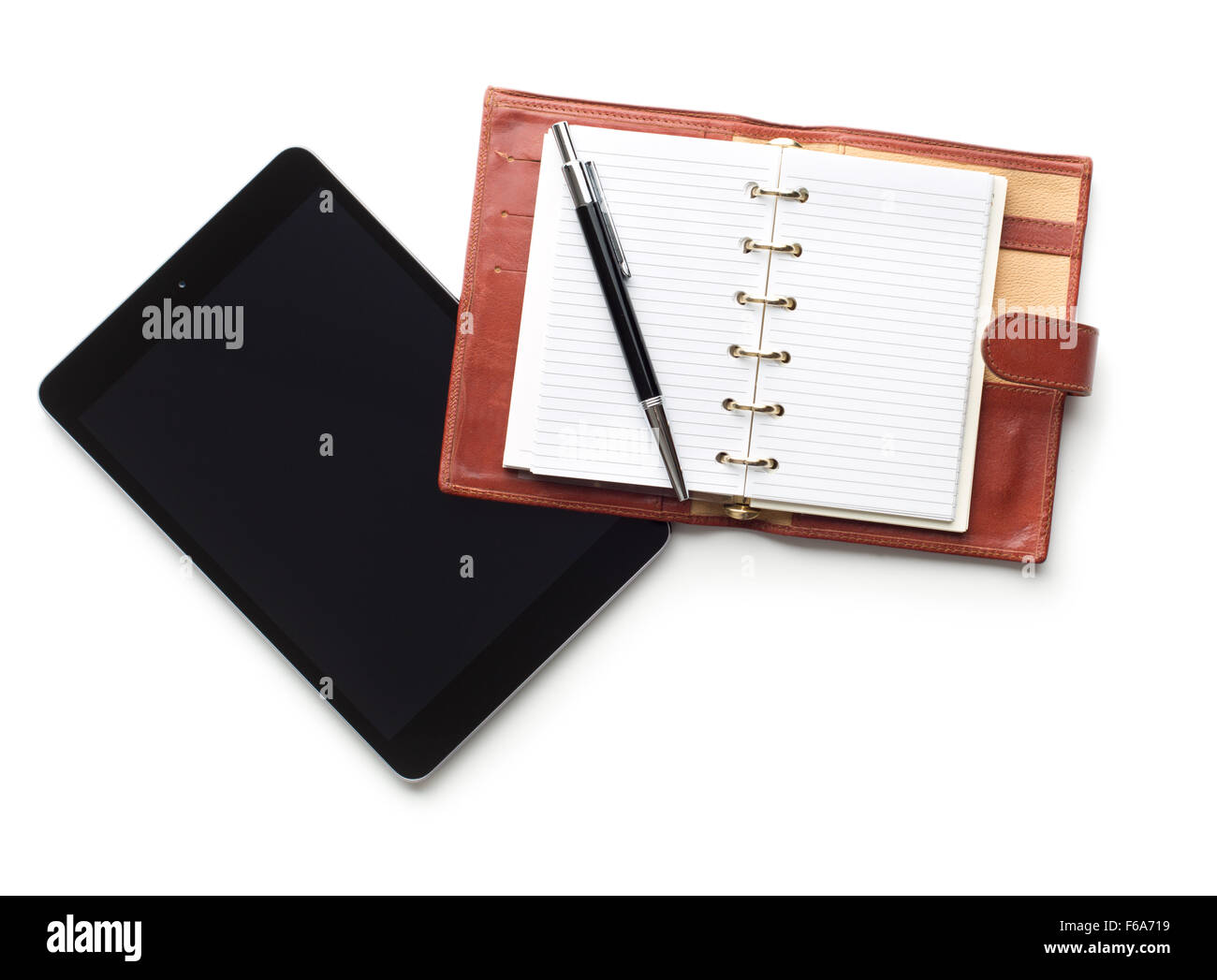 Tablet-Computer mit Stift und Notizbuch Stockfoto