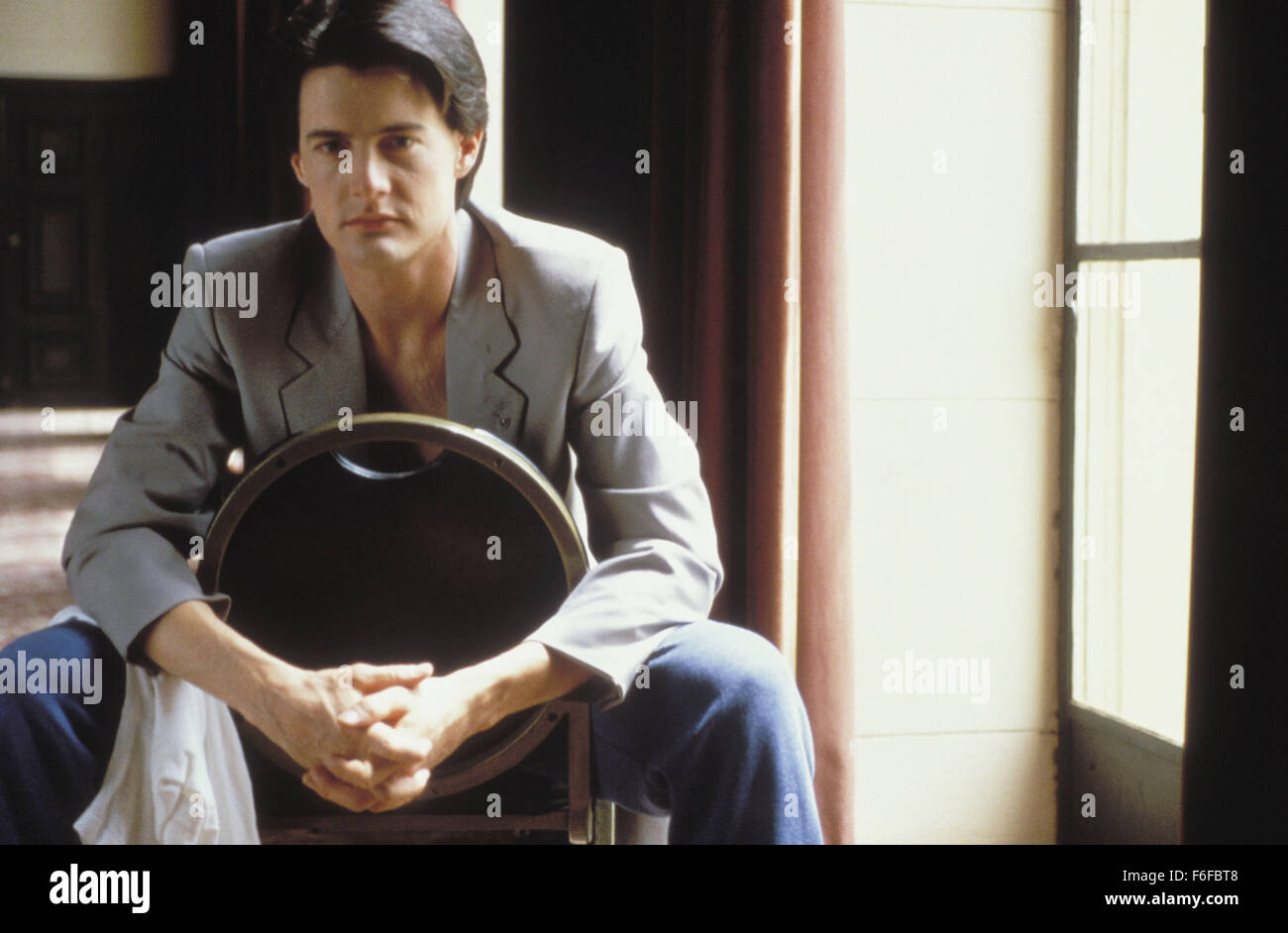 Datum der Freigabe: 20. Oktober 1987. FILMTITEL: Das verborgene. STUDIO: New Line Cinema. PLOT: Ein Außerirdischer ist auf der Flucht in Amerika. Um seine Tritte zu erhalten, tötet es alles, bekommt auf seine Weise, und nutzt den Körper als ein neues Versteck. Im Bild: KYLE MACLACHLAN als Lloyd Gallagher. Stockfoto