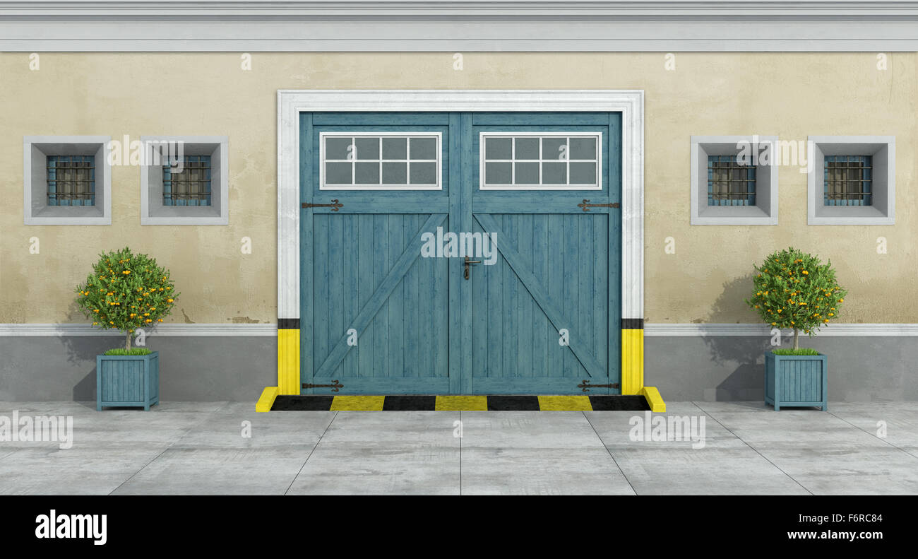 Alte Fassade mit blau aus Holz Garage und kleine Fenster mit Gitter - 3D Rendering Stockfoto