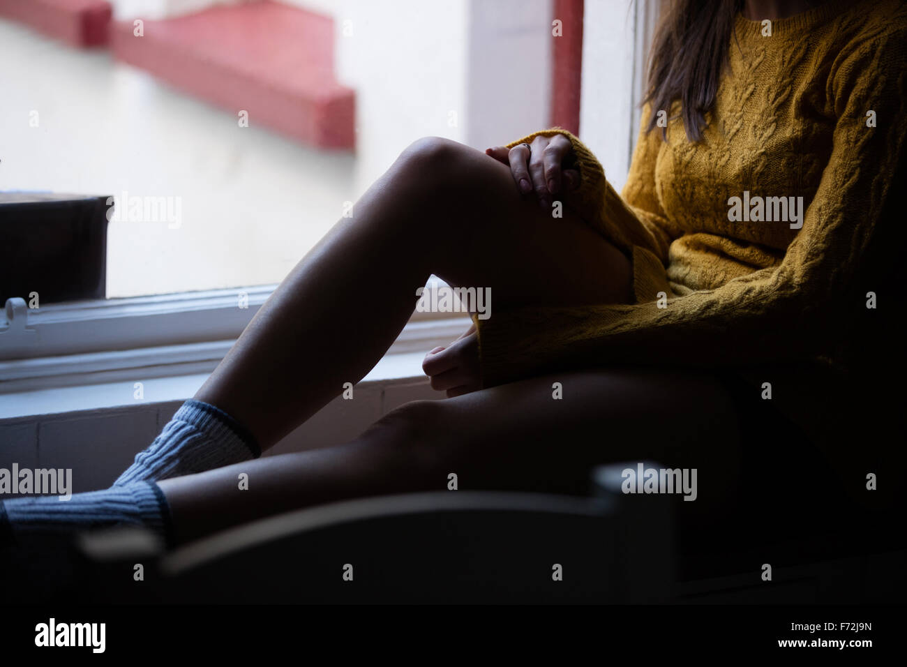 Sitzen Womans Beine Stockfoto