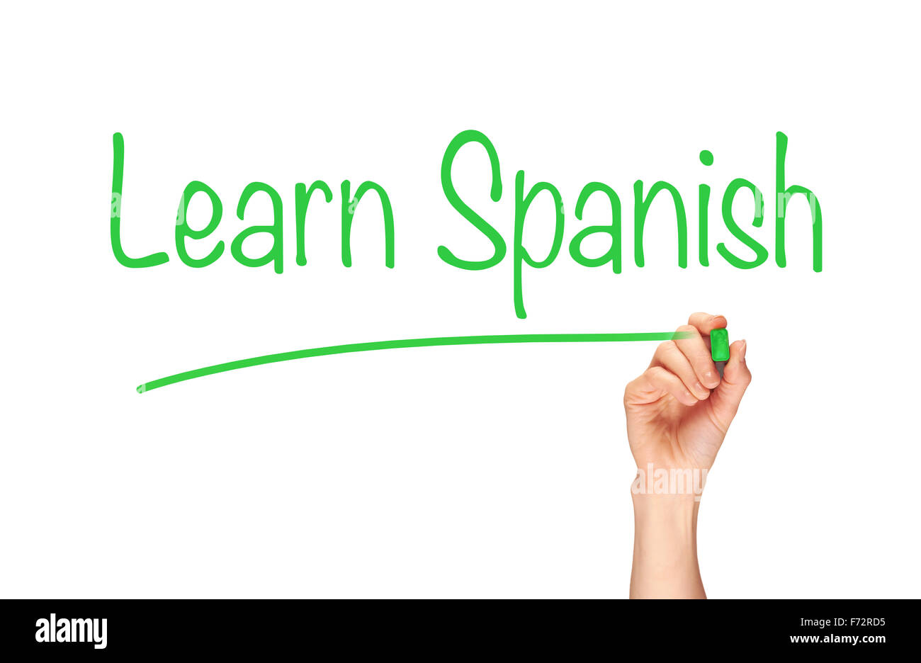 Die Hand einer Frau das Wort Spanisch lernen auf einem klaren Bildschirm zu schreiben. Stockfoto
