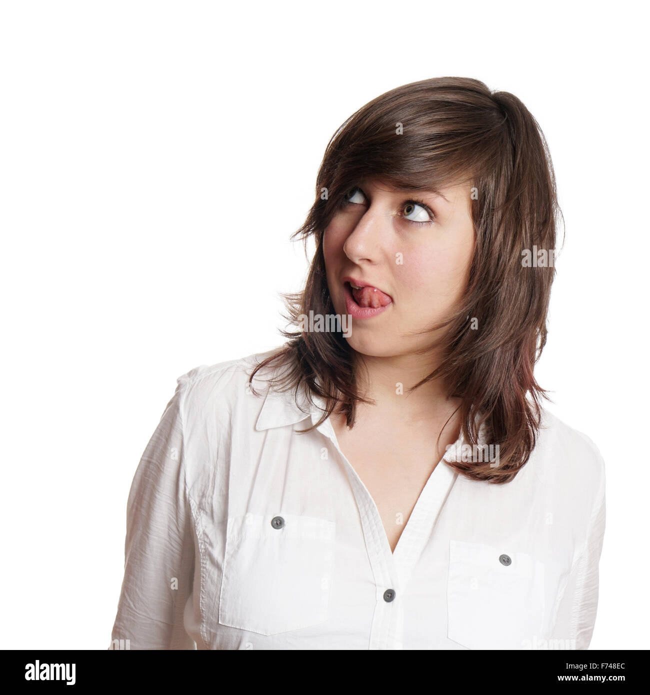 Frau, Lippen lecken und nachschlagen Stockfoto