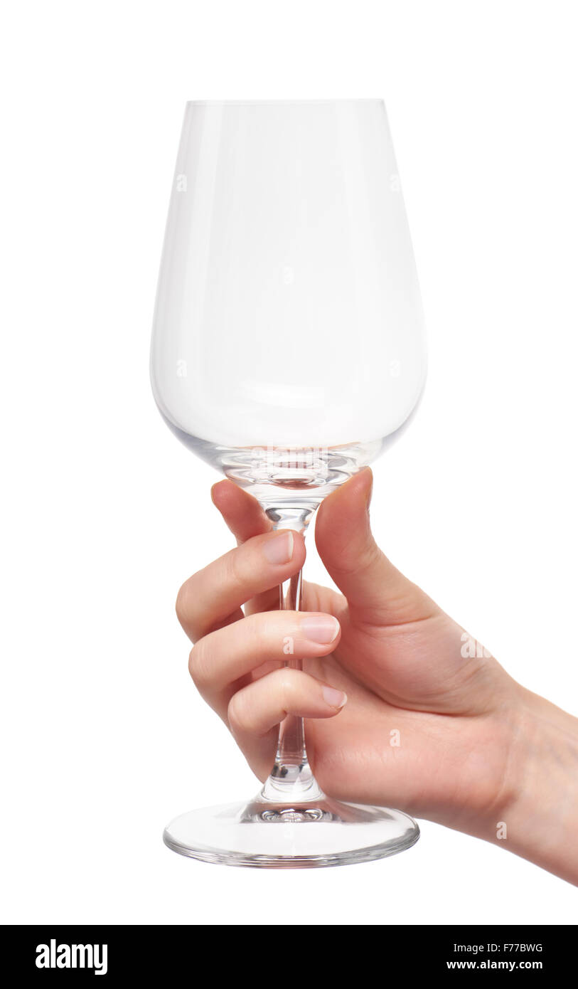 Nahaufnahme von weiblicher Hand mit leeren sauberen transparenten Glas Wein vor weißem Hintergrund. Stockfoto