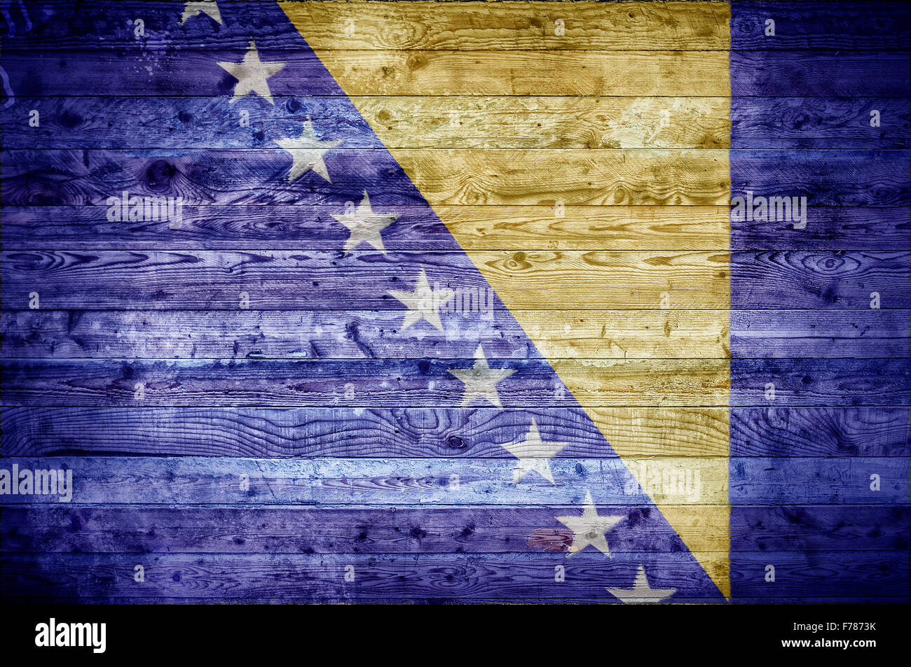 Ein bandtypischen Hintergrundbild der Flagge von Bosnien und Herzegowina auf Holzbrettern einer Wand oder Boden gemalt. Stockfoto
