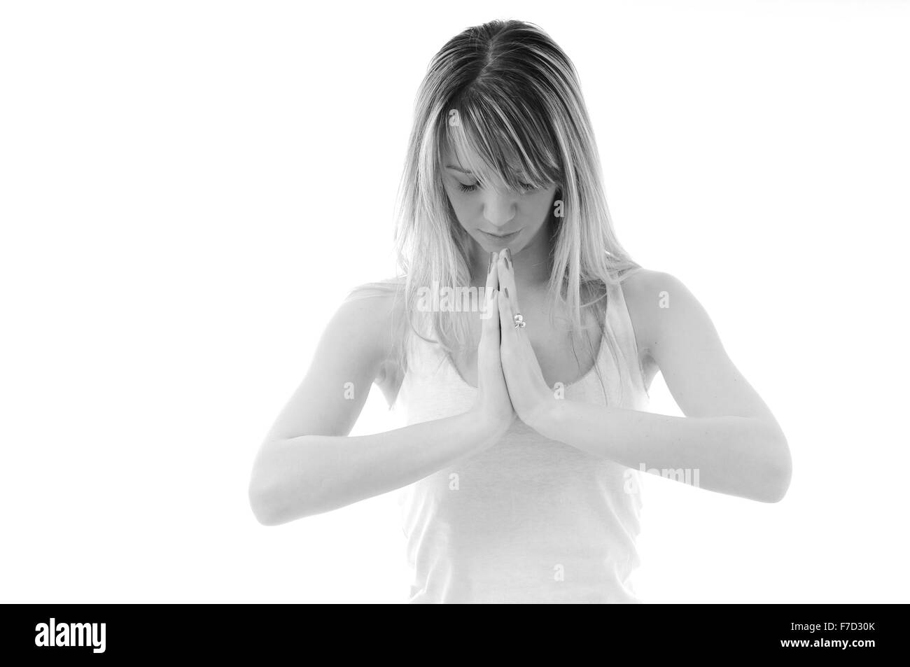 eine junge passen Frau in weißen Hemd meditieren und Übung Yoga isoliert Stockfoto