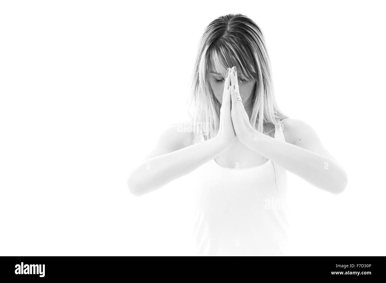 eine junge passen Frau in weißen Hemd meditieren und Übung Yoga isoliert Stockfoto