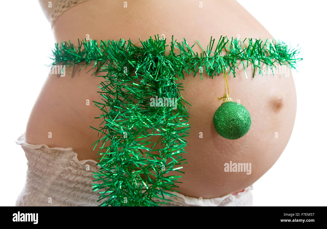 Nahaufnahme der schwangeren Frau Bauch mit Weihnachtsschmuck Stockfoto