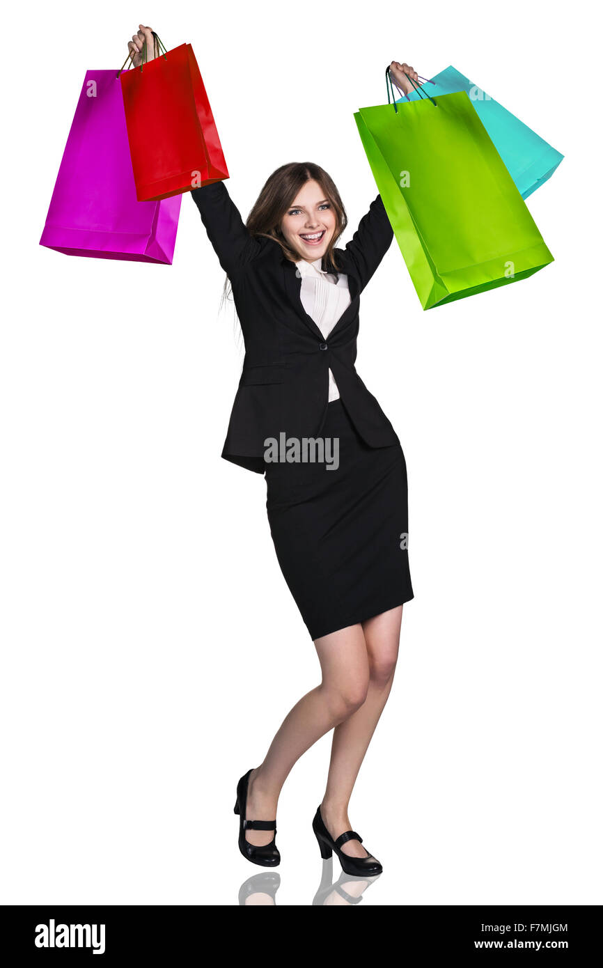 Frau in Abendgarderobe mit bunten Pakete isoliert auf weiss. -Shopping-Konzept Stockfoto