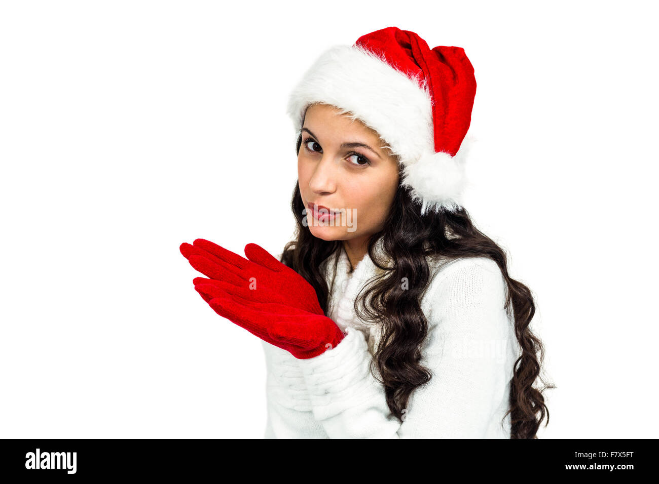 Attraktive Frau mit roten Handschuhen weht Kuss Stockfoto