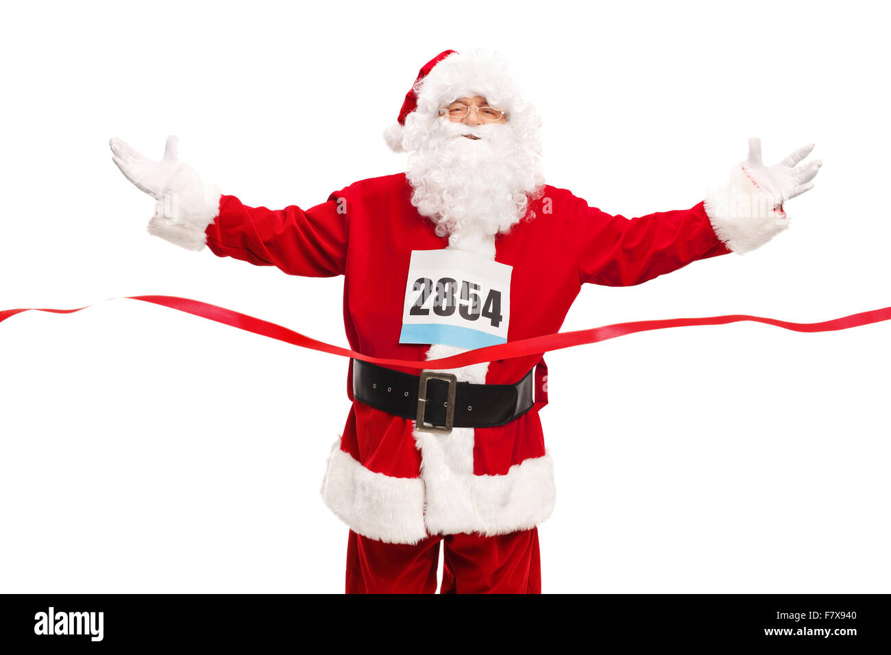 Studioaufnahme von Santa Claus eine Startnummer auf der Brust tragen und Überquerung der Ziellinie isoliert auf weißem Hintergrund Stockfoto