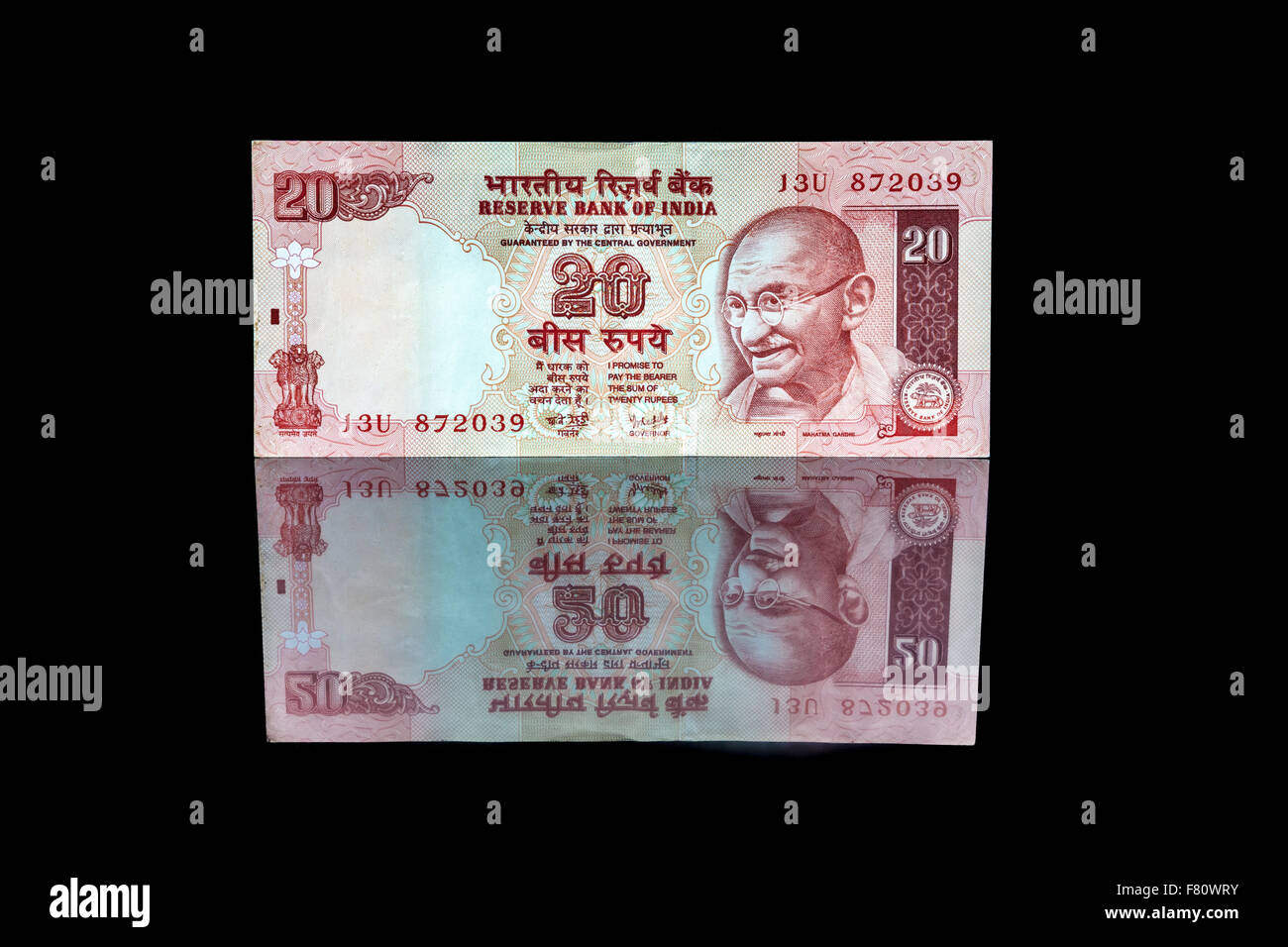 20 Rupien Bill in Reflexion auf schwarz Stockfoto