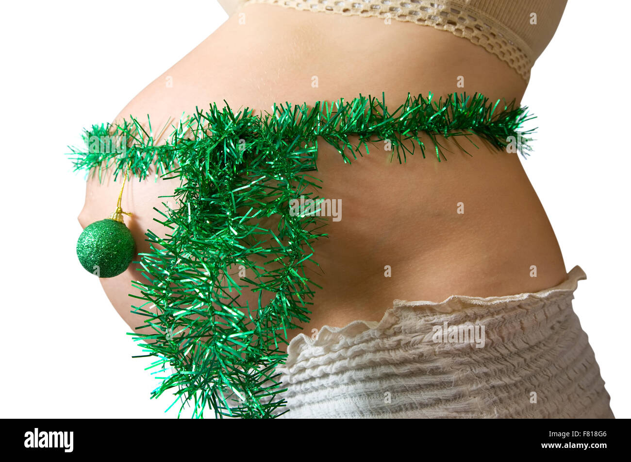Nahaufnahme der schwangeren Frau Bauch mit Weihnachtsschmuck Stockfoto