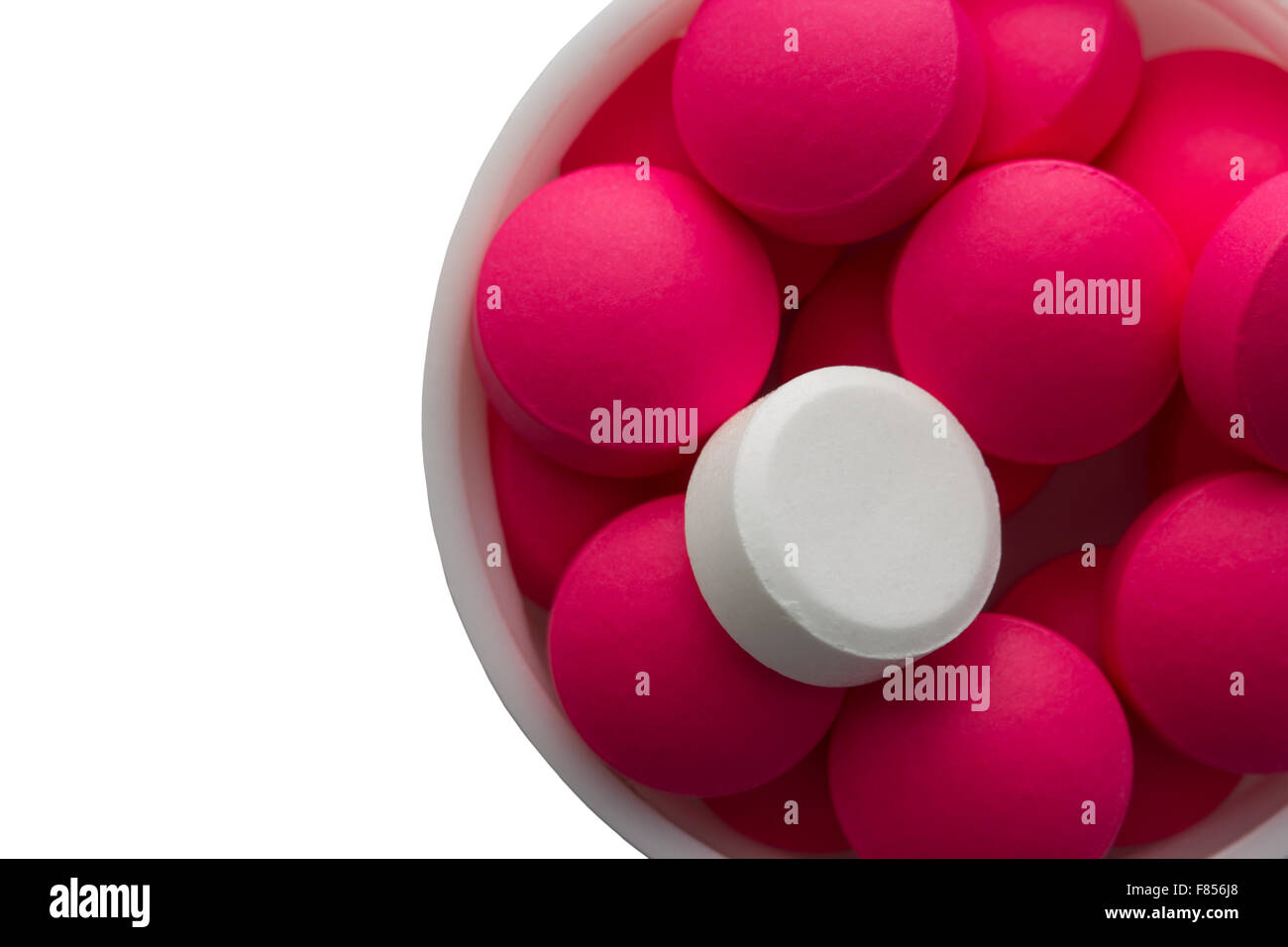 Closeup weiß-rosa Pillen in weißem Kunststoff-Flasche Stockfoto