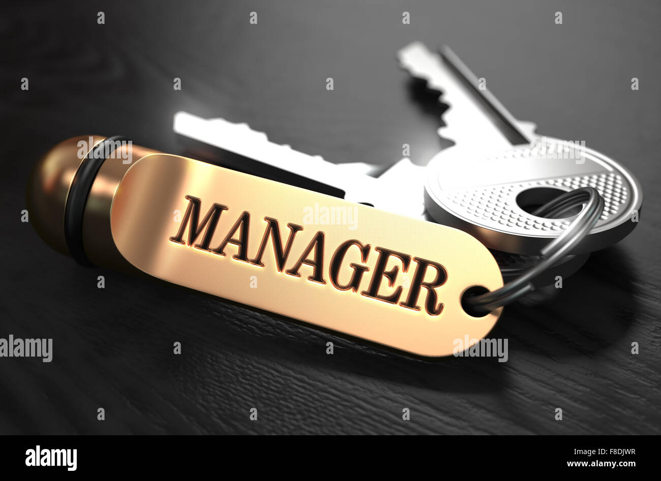 Manager - Schlüsselbund mit Text auf goldenen Schlüsselanhänger. Stockfoto