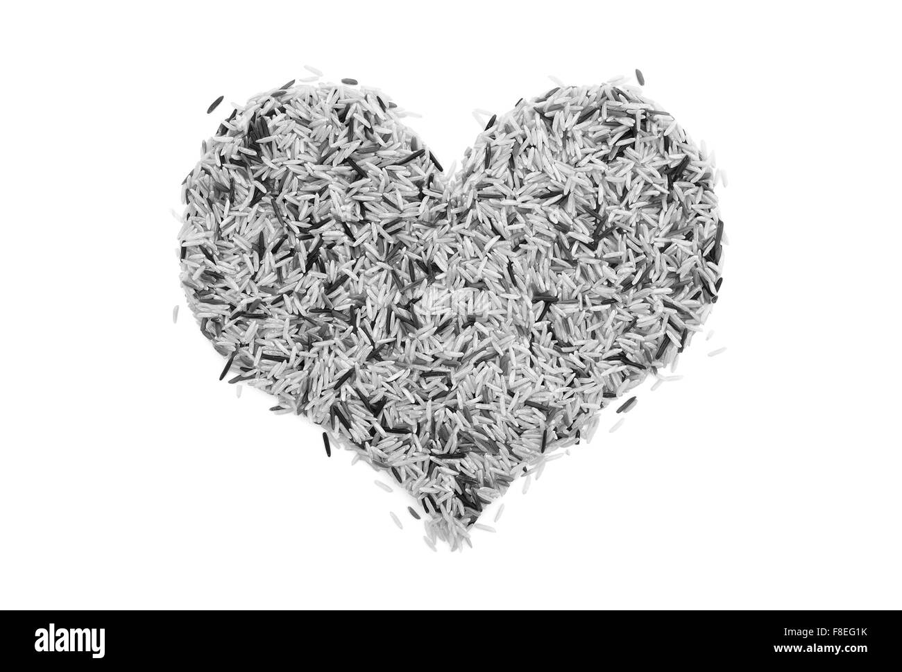 Wildreis in Form eines Herzens, isoliert auf einem weißen Hintergrund - monochrome Verarbeitung Stockfoto